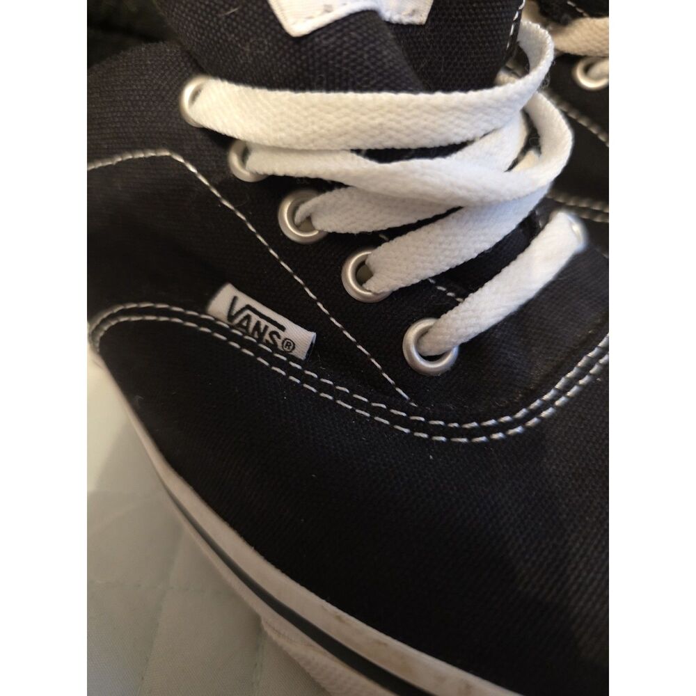 These are black Vans Authentic sneakers with white laces. - Picture 5 of 9